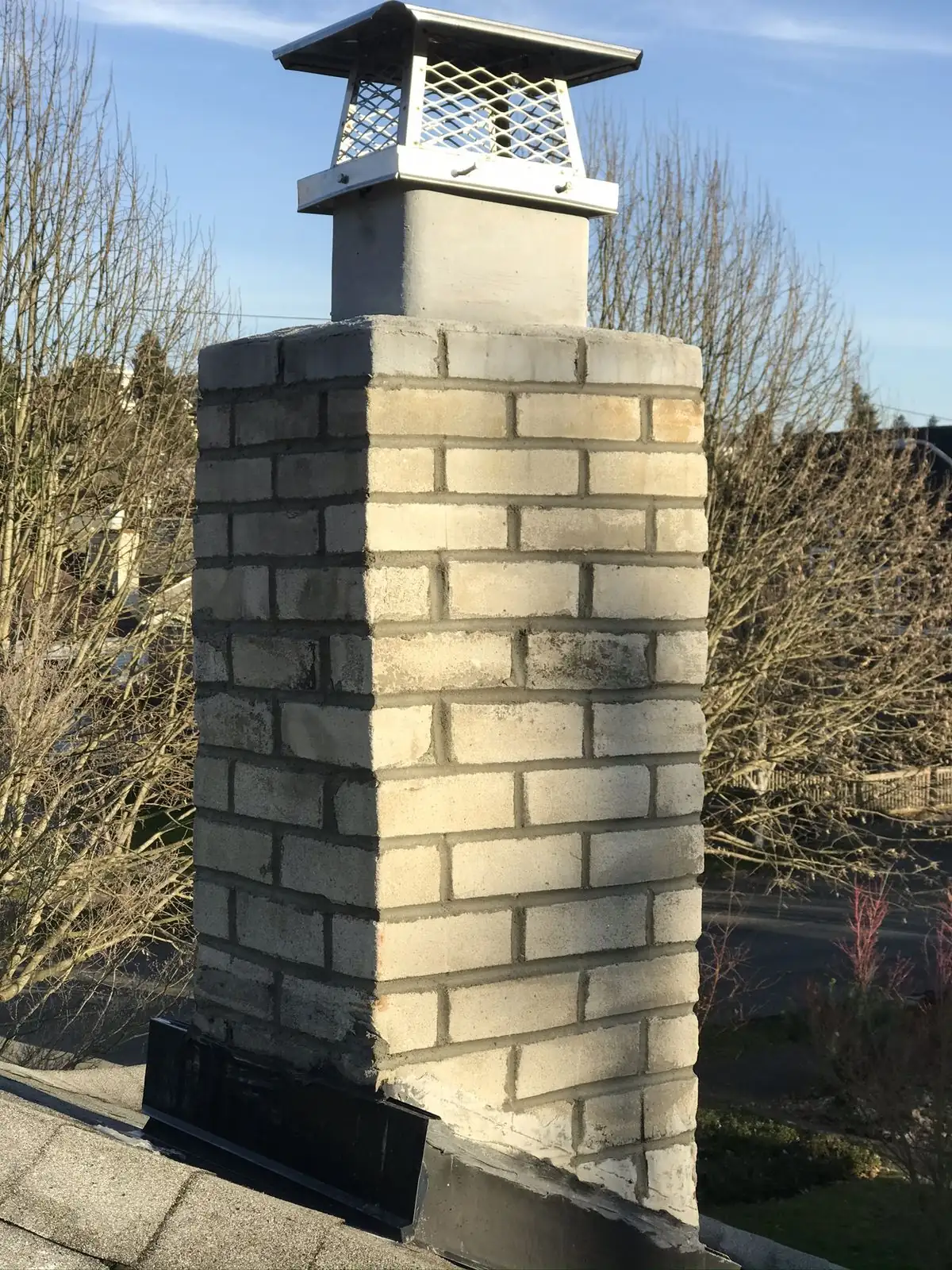 Complete chimney rebuild with white brick